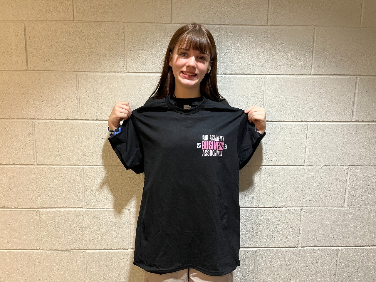 Ryan Coursey, AAHS Marketing 2 and Creative Marketing student shows off one of the new t-shirt designs